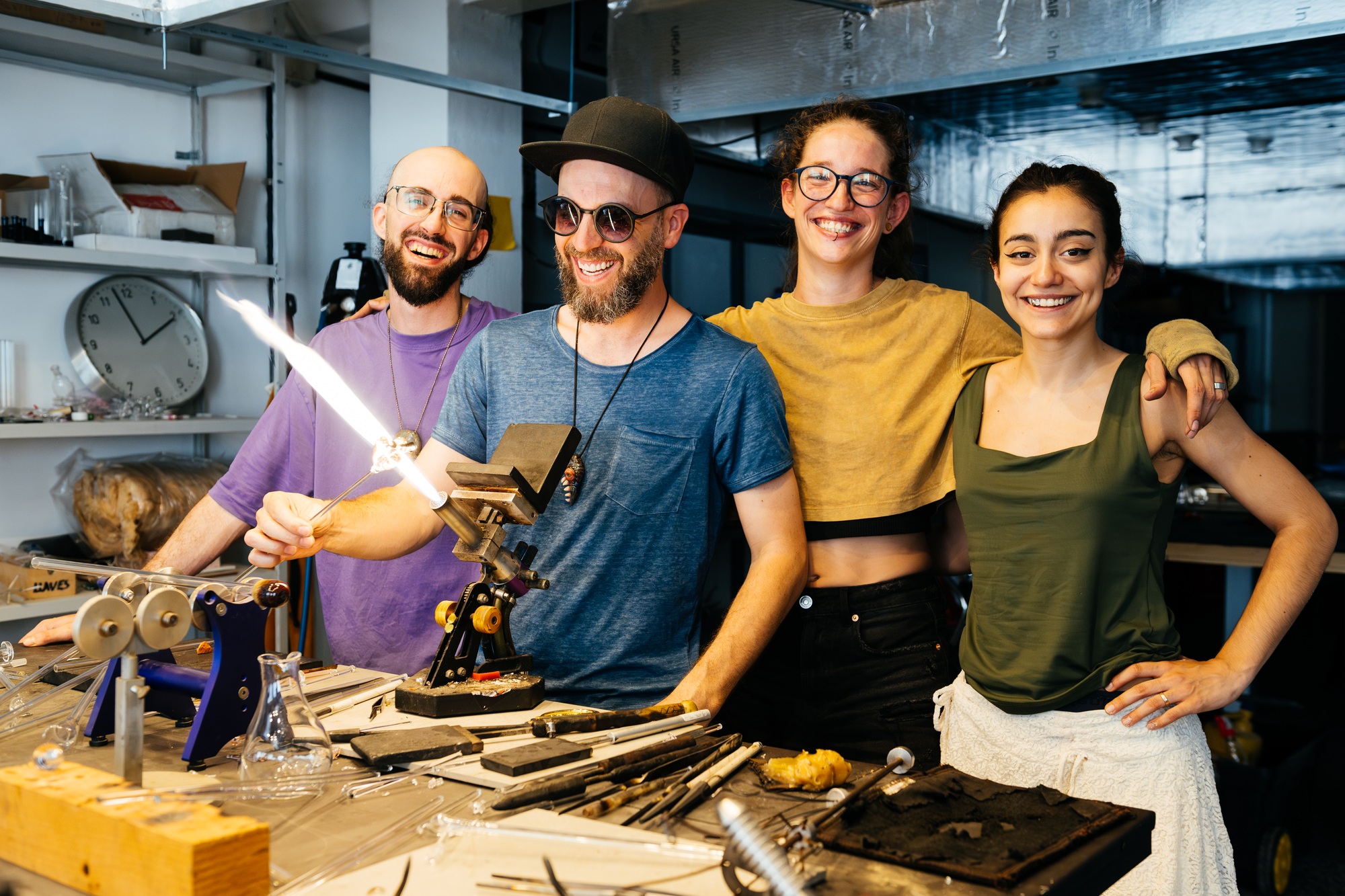 Friends Gather for a Fun Portrait at a Vibrant Glass Workshop