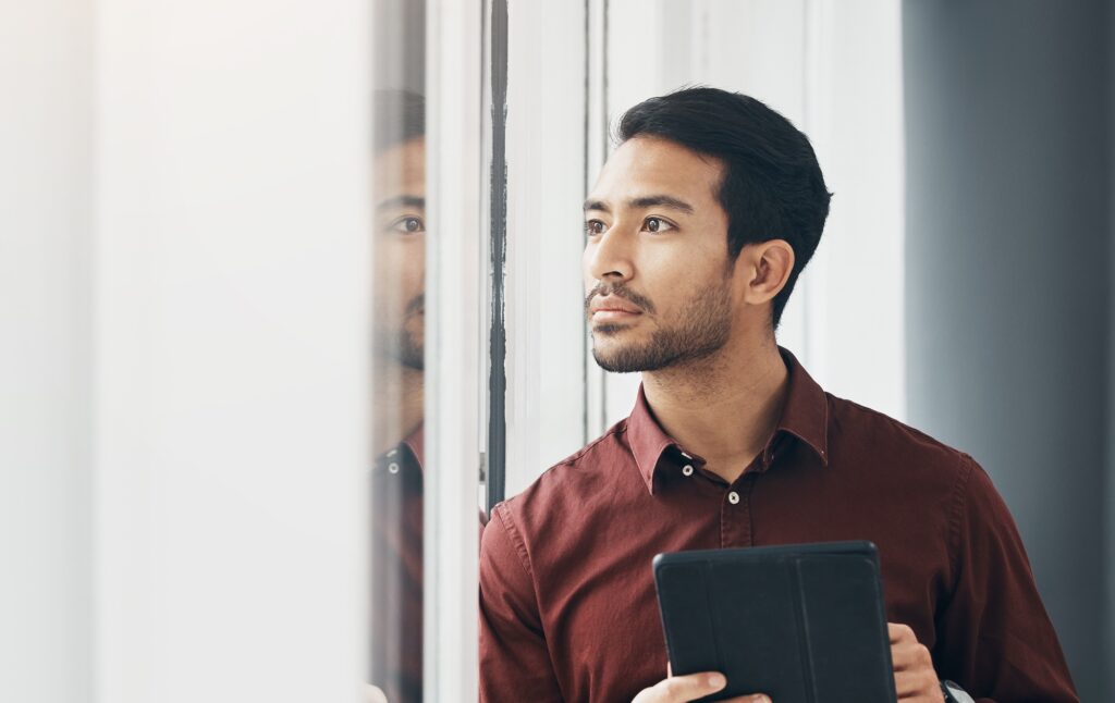 Tablet, window and Indian man thinking, concentration and planning digital business project idea. S